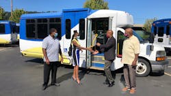 TriMet General Manager Sam Desue, Jr. hands keys to Pat Daniels, executive director of Constructing Hope. TriMet General Manager Sam Desue, Jr. hands keys to Pat Daniels, executive director of Constructing Hope.