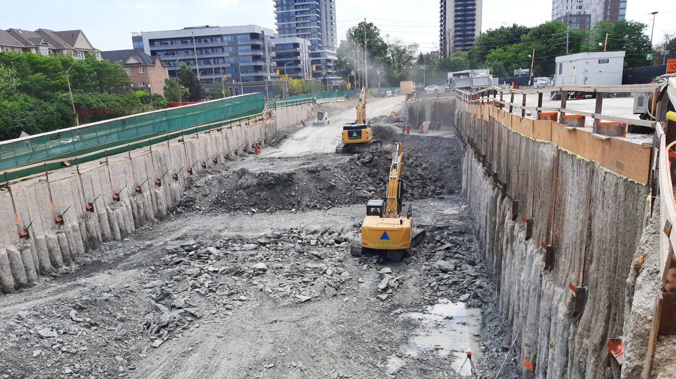 Excavators make progress on the Hurontario LRT project construction at Port Credit GO.