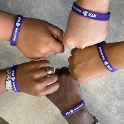 #vaccinated wrist bands with New Orleans RTA branding.