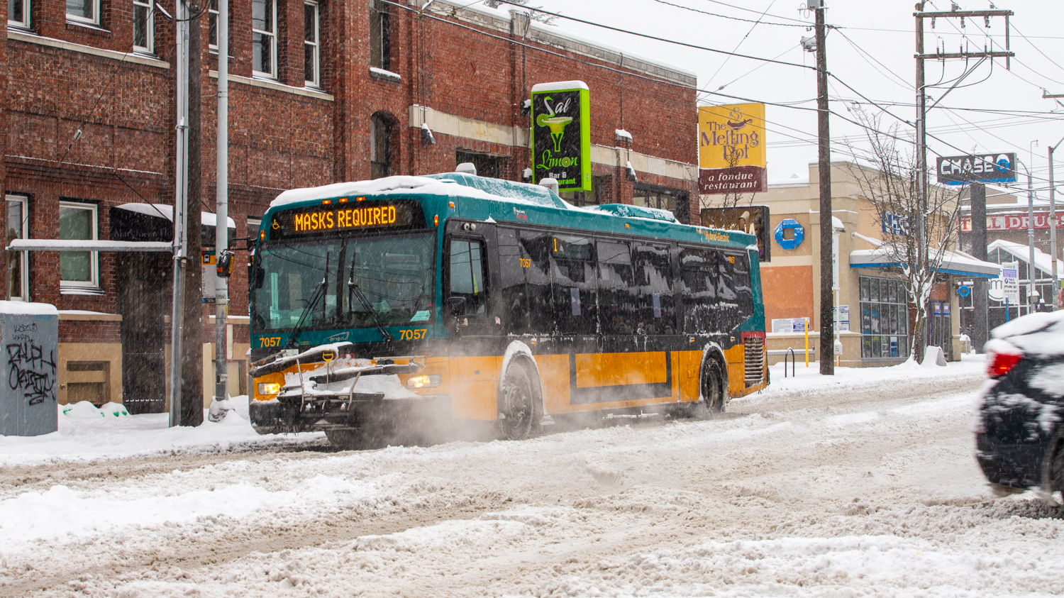 A King County Metro bus shown this past winter reminding riders masks are needed to ride.