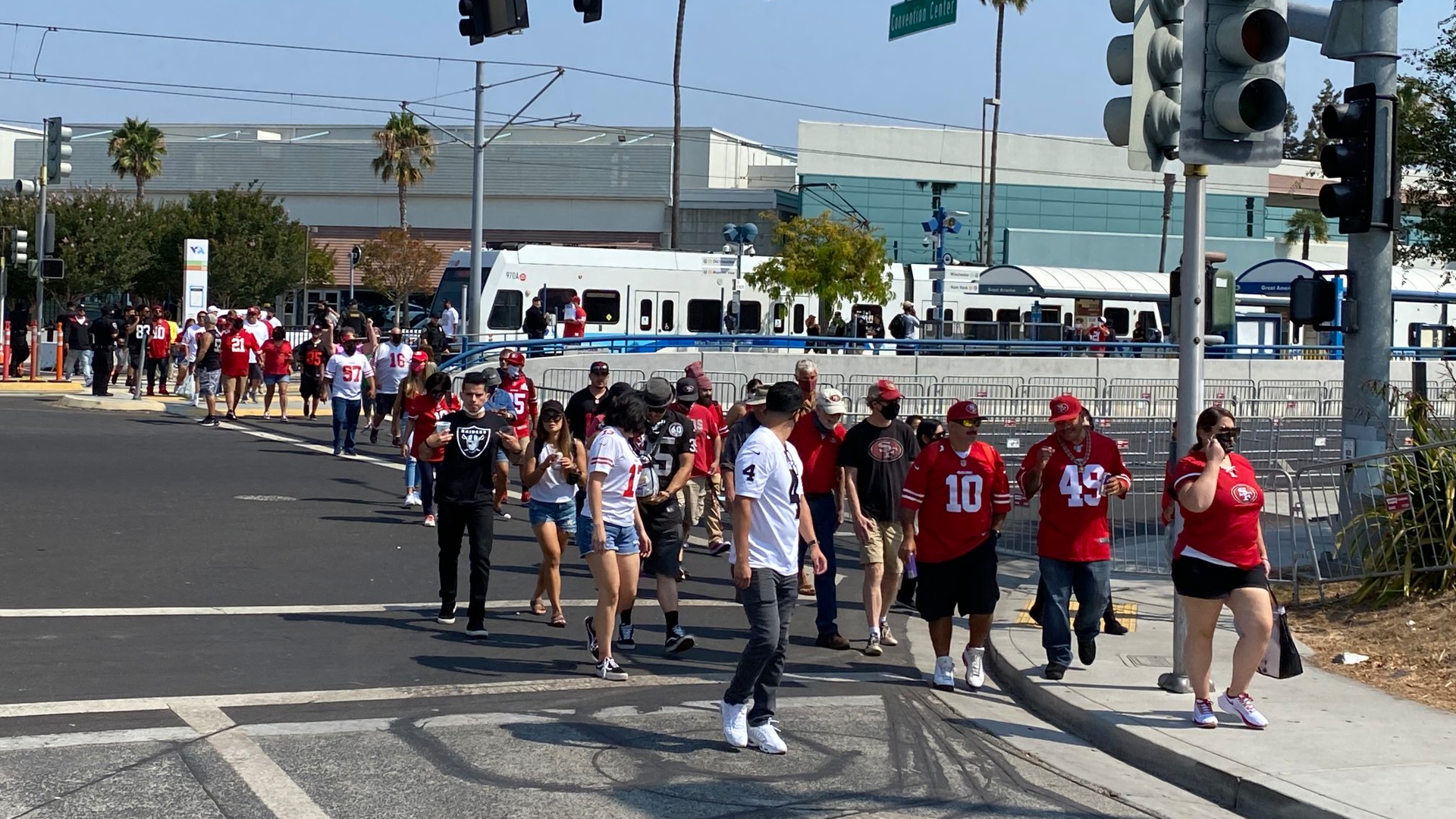 49er fans and a handful of Raiders fans depart a Santa Clara VTA light-rail train prior to the two teams playing at Levi's Stadium on Aug. 29. The day marked the first time riders could take light-rail since the end of May.