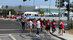 49er fans and a handful of Raiders fans depart a Santa Clara VTA light-rail train prior to the two teams playing at Levi's Stadium on Aug. 29. The day marked the first time riders could take light-rail since the end of May.