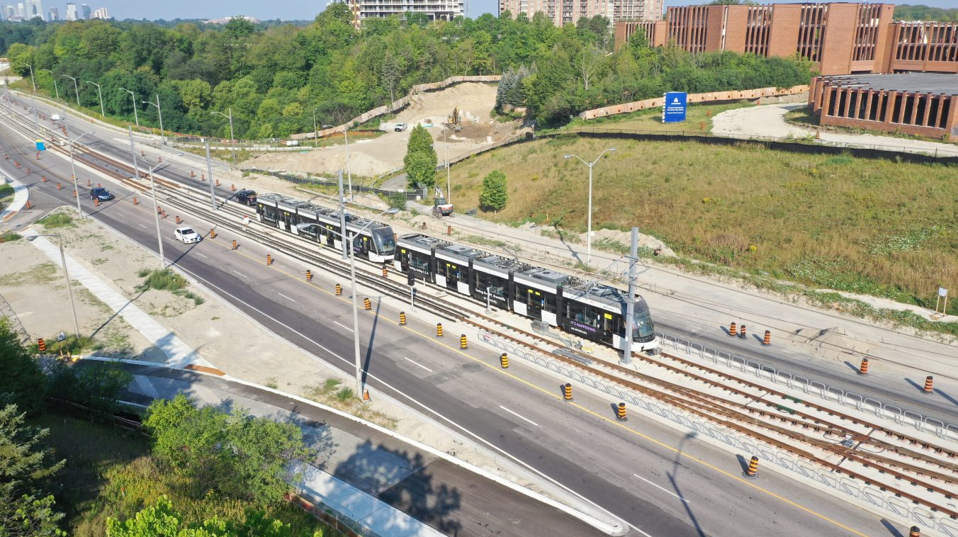 Two Crosstown vehicles head out on one of the first test runs along Eglinton Avenue East.
