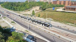Two Crosstown vehicles head out on one of the first test runs along Eglinton Avenue East. Two Crosstown vehicles head out on one of the first test runs along Eglinton Avenue East.