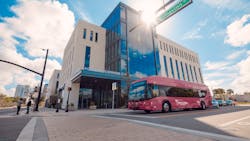 A LYNX bus waiting for a light at UCF's Dr. Phillips Academic Commons in downtown Orlando. Photo taken prior to COVID-19. A LYNX bus waiting for a light at UCF's Dr. Phillips Academic Commons in downtown Orlando. Photo taken prior to COVID-19.