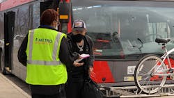 A member of the CapMetro team handing out safety care packages to riders. A member of the CapMetro team handing out safety care packages to riders.