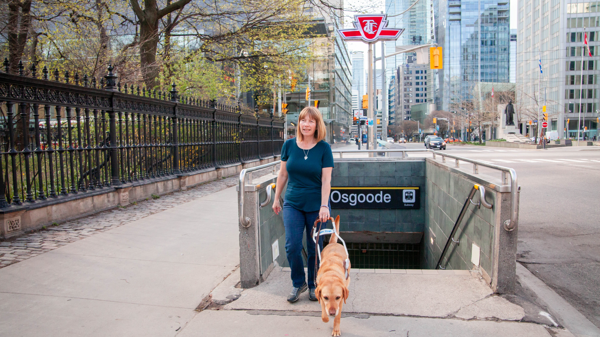 Denise Chamberlin with her guide dog Ridley emerges from the Toronto subway.