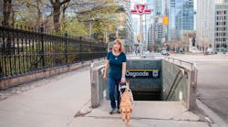 Denise Chamberlin with her guide dog Ridley emerges from the Toronto subway.