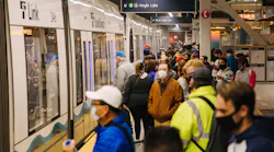 Riders take one of the first Line 1 trains during opening day, Oct. 2.