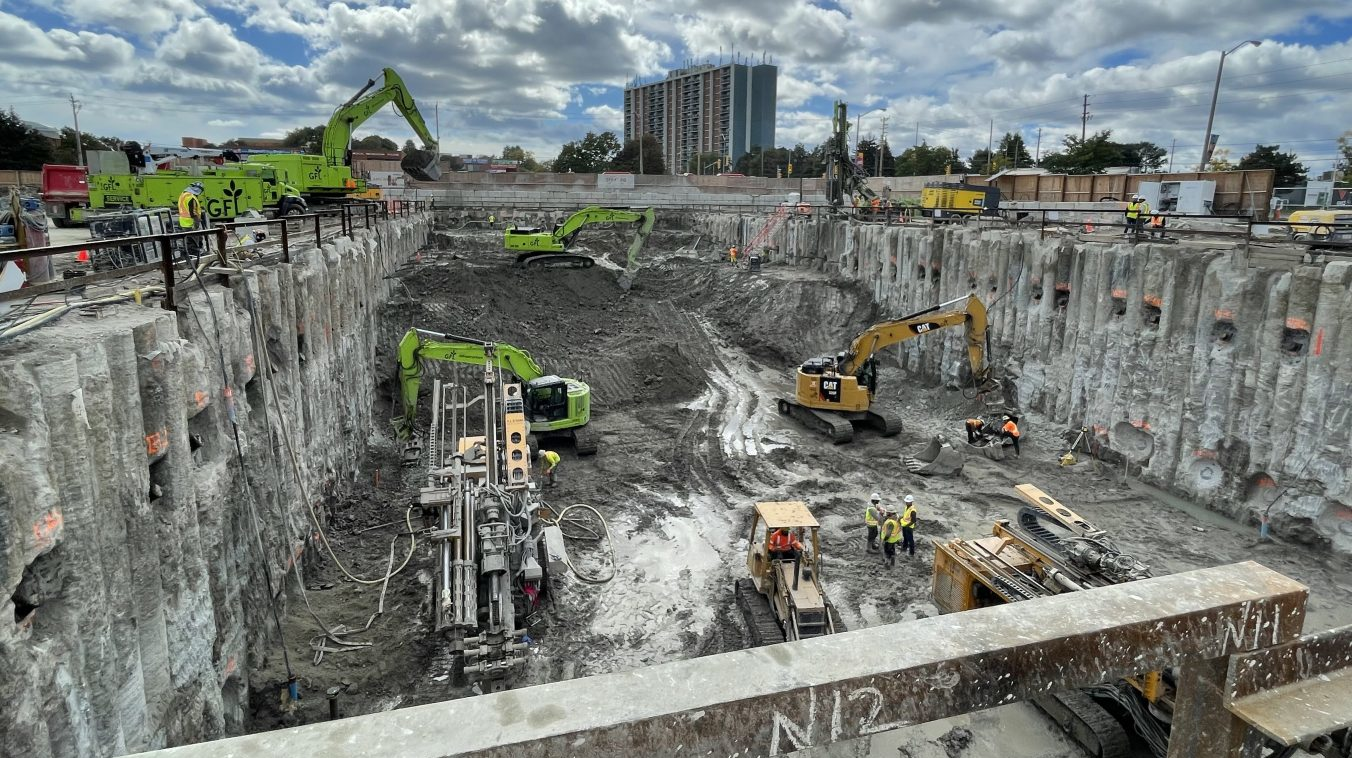 Excavators and other heavy machinery are digging deep to build the launch shaft for the tunnel boring machine.