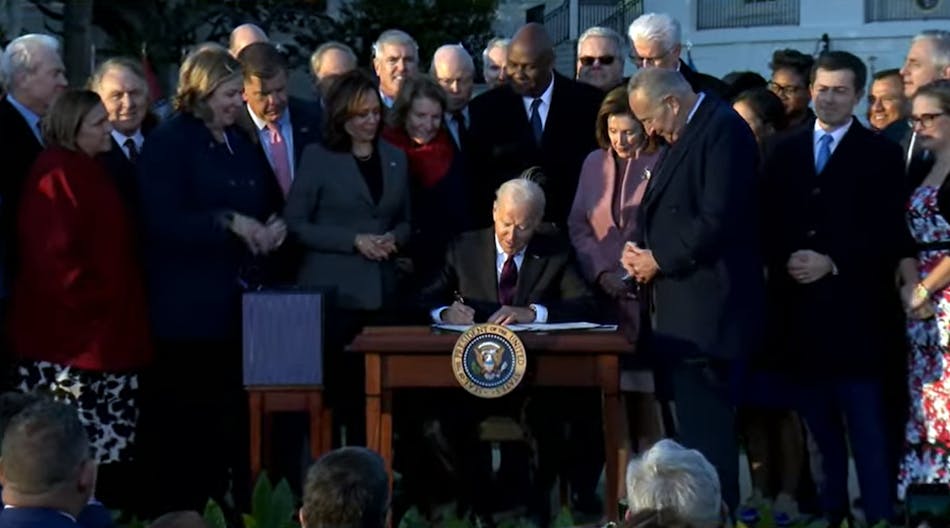 President Joe Biden signs the Bipartisan Infrastructure Deal into law on Nov. 15, 2021.