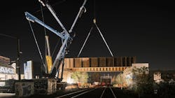 The steel girders are lifted into place by crane. The steel girders are lifted into place by crane.