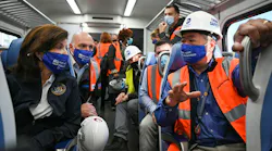 Gov. Hochul listens to LIRR President Phillip Eng on a LIRR train from Jamaica to Grand Central Terminal in Manhattan to take the first ceremonial train through the new site.