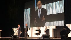 APTA CEO Paul Skoutelas, left and on screen, and APTA Chair Jeff Nelson speak during the opening session of APTA TRANSform Conference and EXPO on Nov. 8.