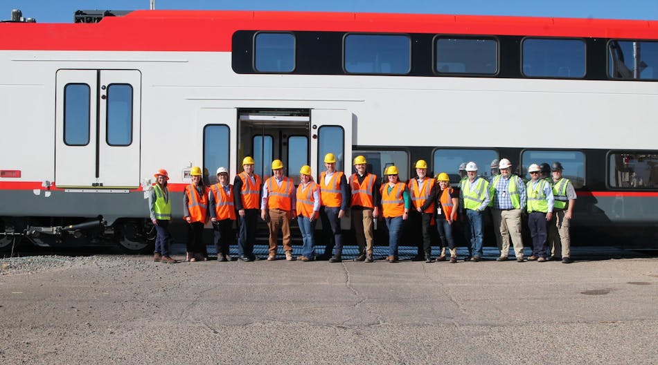 The teams from TTCI, Caltrain and Stadler with John Putnam (Deputy General Counsel for the U.S. Department of Transportation) an Cindy Terwilliger (FTA Region 8 Regional Administrator) in front of the new electric EMU in Pueblo, Colo.