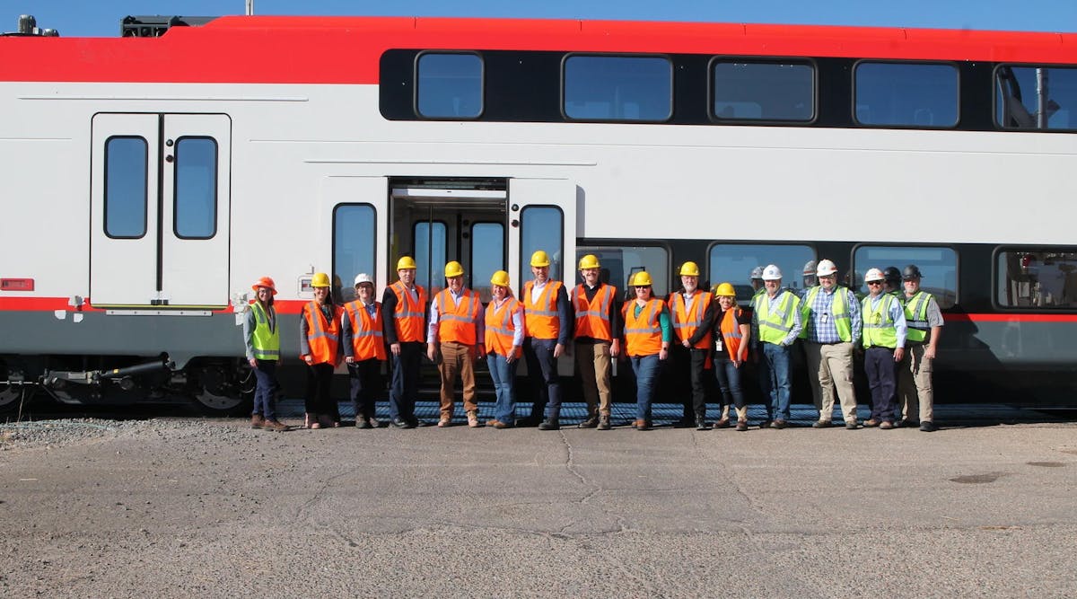 The teams from TTCI, Caltrain and Stadler with John Putnam (Deputy General Counsel for the U.S. Department of Transportation) an Cindy Terwilliger (FTA Region 8 Regional Administrator) in front of the new electric EMU in Pueblo, Colo.