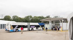 One of two of MTD&rsquo;s 60-foot hydrogen fuel cell buses pulls the fuel island, recently upgraded to incorporate fueling with hydrogen, produced on-site.