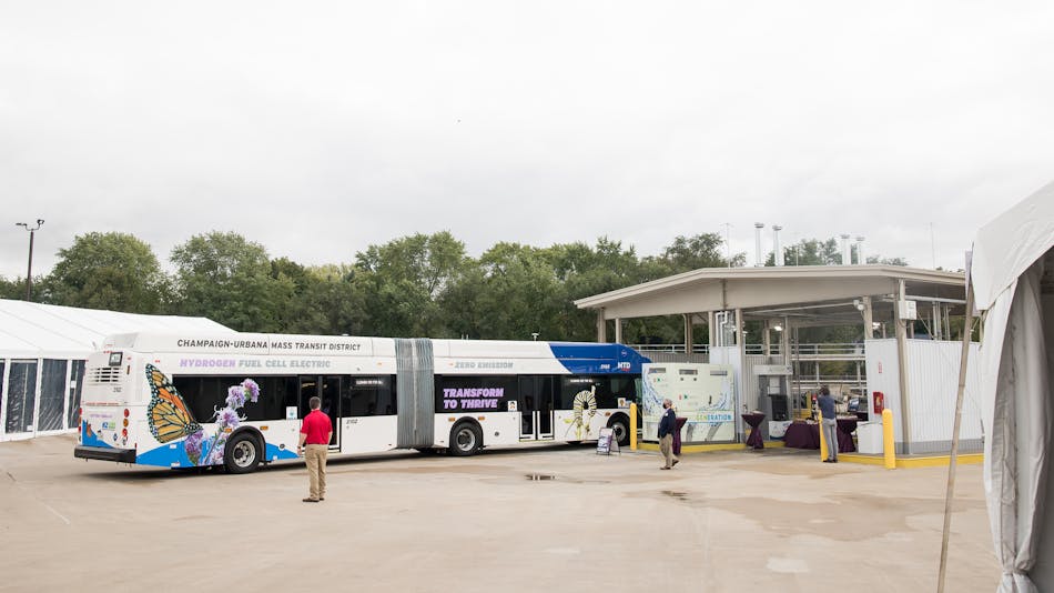 One of two of MTD&rsquo;s 60-foot hydrogen fuel cell buses pulls the fuel island, recently upgraded to incorporate fueling with hydrogen, produced on-site.