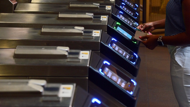 In this August 2019 image, a New York City Transit patron taps into the system using a credit/debit card. MTI is urging action to protect PII as more transit systems expand data collection through platforms such as contactless fare systems.