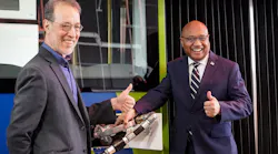 General Manager Sam Desue Jr. and Oregon State Sen. Michael Dembrow give a thumbs up after fueling a TriMet bus with renewable diesel.