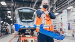 Art Wittich, a SkyTrain vehicle technologist, shows the hockey stick used to clear ice from doors during the winter season. Art Wittich, a SkyTrain vehicle technologist, shows the hockey stick used to clear ice from doors during the winter season.