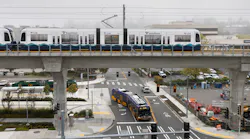 A Sound Transit light rail train leaves the Northgate station as a King County Metro bus passes underneath on Oct. 2, 2021 in Seattle.
