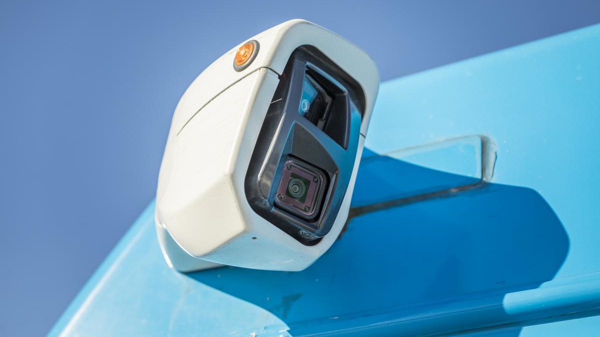 A rear-facing camera is mounted on the outside of a STM bus.