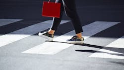 Pedestrian in crosswalk. Pedestrian in crosswalk.