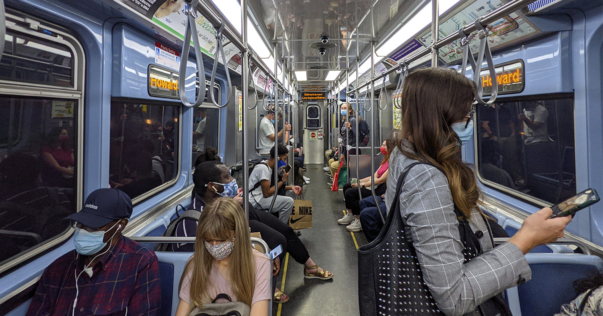 Passengers riding a CTA train to Howard.