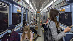 Passengers riding a CTA train to Howard.