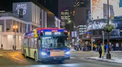 A C Line BRT bus drives in downtown Minneapolis, near the Target Center.