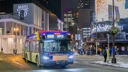 A C Line BRT bus drives in downtown Minneapolis, near the Target Center. A C Line BRT bus drives in downtown Minneapolis, near the Target Center.