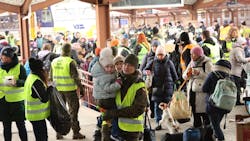 Ukrainian refugees transfer from a Ukrainian Railways train at Przemyśl station in Poland to a RegioJet train; the effort is part of a humanitarian partnership between the rail carriers and non-profit Člověk v tísni to evacuate civilians out of the country and bring provisions into Ukraine. Ukrainian refugees transfer from a Ukrainian Railways train at Przemyśl station in Poland to a RegioJet train; the effort is part of a humanitarian partnership between the rail carriers and non-profit Člověk v tísni to evacuate civilians out of the country and bring provisions into Ukraine.