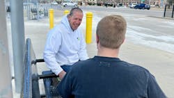 A Chestnut Health employee interacts with a rider on the St. Louis Metro transit system. A Chestnut Health employee interacts with a rider on the St. Louis Metro transit system.