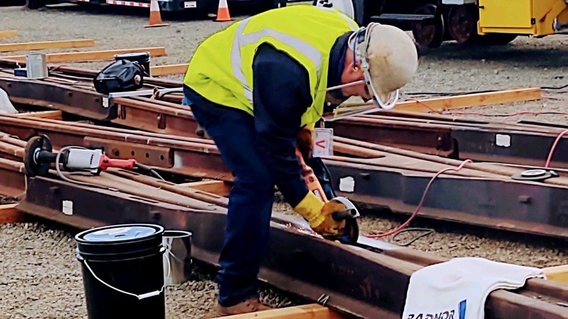 Welder Preston Krone of Morrison Metalweld Process Corp. working on a frog.