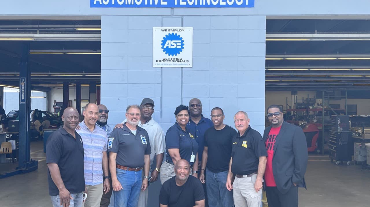 New Orleans RTA officials including CEO Alex Wiggins (back center) visited Louisiana State Penitentiary's auto mechanic program. New Orleans RTA is partnering with JOB1 NOLA and the Louisiana Workforce Commission to recruit mechanics and technicians from the program.