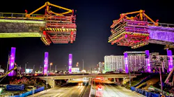 Part of the elevated guideway is being lifted into place over Sepulveda Blvd.