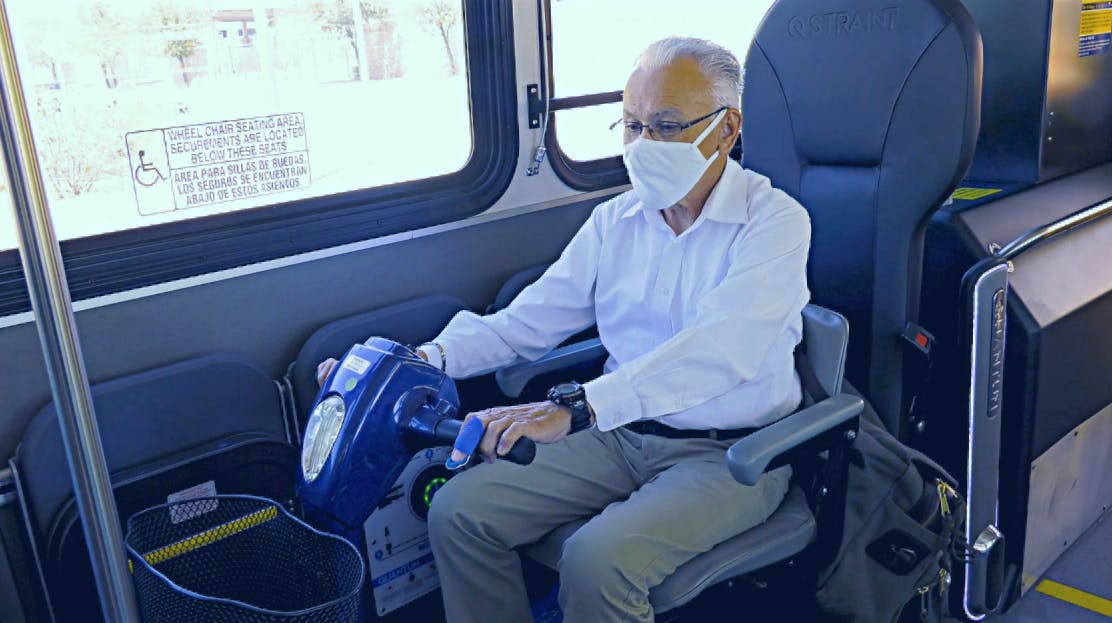 Rider In Scooter Uses Quantum Device On A Sun Tran Bus