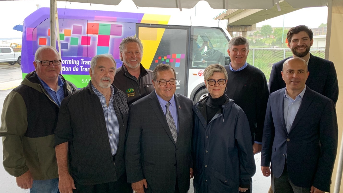 L to R: John MacKenzie, Deputy Mayor, Saint John, Gerry Lowe, Councilor, Saint John, Greg Stewart, Councilor, Saint John, Hon. Gary Crossman, Minister of Environment and Climate Change, Donna Reardon, Mayor, Saint John, Roger D&rsquo;Hollander, COO, Damera Bus Corp, David Hickey, Councilor, Saint John, and Deniz Cetin, CCO, Karsan Automotive.