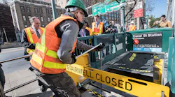 An MTA worker demonstrates how retractable stairwell covers are deployed in this October 2017 image. The covers are one of several flood mitigation devices MTA purchased and installed following Superstorm Sandy in 2012.