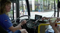 This 2015 image shows TriMet bus operator Catherine greeting a customer as they board. TriMet has increased its new operator starting pay, as well as its hiring bonus as a way to boost recruitment.