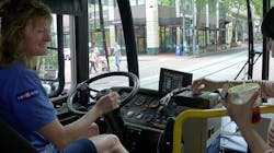 This 2015 image shows TriMet bus operator Catherine greeting a customer as they board. TriMet has increased its new operator starting pay, as well as its hiring bonus as a way to boost recruitment.