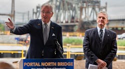 New Jersey Gov. Phil Murphy and NJ Transit President and CEO Kevin S. Corbett at the groundbreaking event held Aug. 1 for the Portal North Bridge, which can be seen in the background.