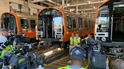 General Manger Poftak discusses the progress of work with members of the media at Wellington Station adjacent to some of the new Orange Line cars. General Manger Poftak discusses the progress of work with members of the media at Wellington Station adjacent to some of the new Orange Line cars.