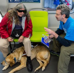 Aaron Weinstein, right, speaks with a transit rider. Aaron Weinstein, right, speaks with a transit rider.