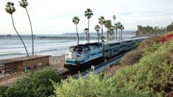 A Metrolink train moves along the coast line track in San Clemente; emergency repairs are required to be made in south San Clemente to stabilize track that has experienced strong storm surge.