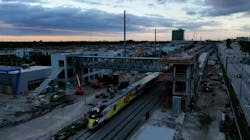 Crews worked early during the morning hours of Oct. 8 to place place a 131-foot long, 68-ton pedestrian skybridge on two 41-foot-high vertical transportation towers at Aventura Station. Crews worked early during the morning hours of Oct. 8 to place place a 131-foot long, 68-ton pedestrian skybridge on two 41-foot-high vertical transportation towers at Aventura Station.