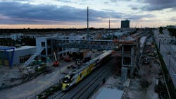 Crews worked early during the morning hours of Oct. 8 to place place a 131-foot long, 68-ton pedestrian skybridge on two 41-foot-high vertical transportation towers at Aventura Station.