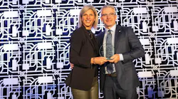 STM CEO Marie-Claude Léonard, left, with former CEO Luc Tremblay who received the William G. Ross Lifetime Achievement Award at the CUTA 2022 conference in Montréal.