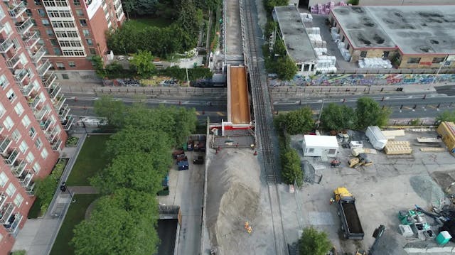 Looking north over Bloor Street West with new west span of the rail bridge constructed.